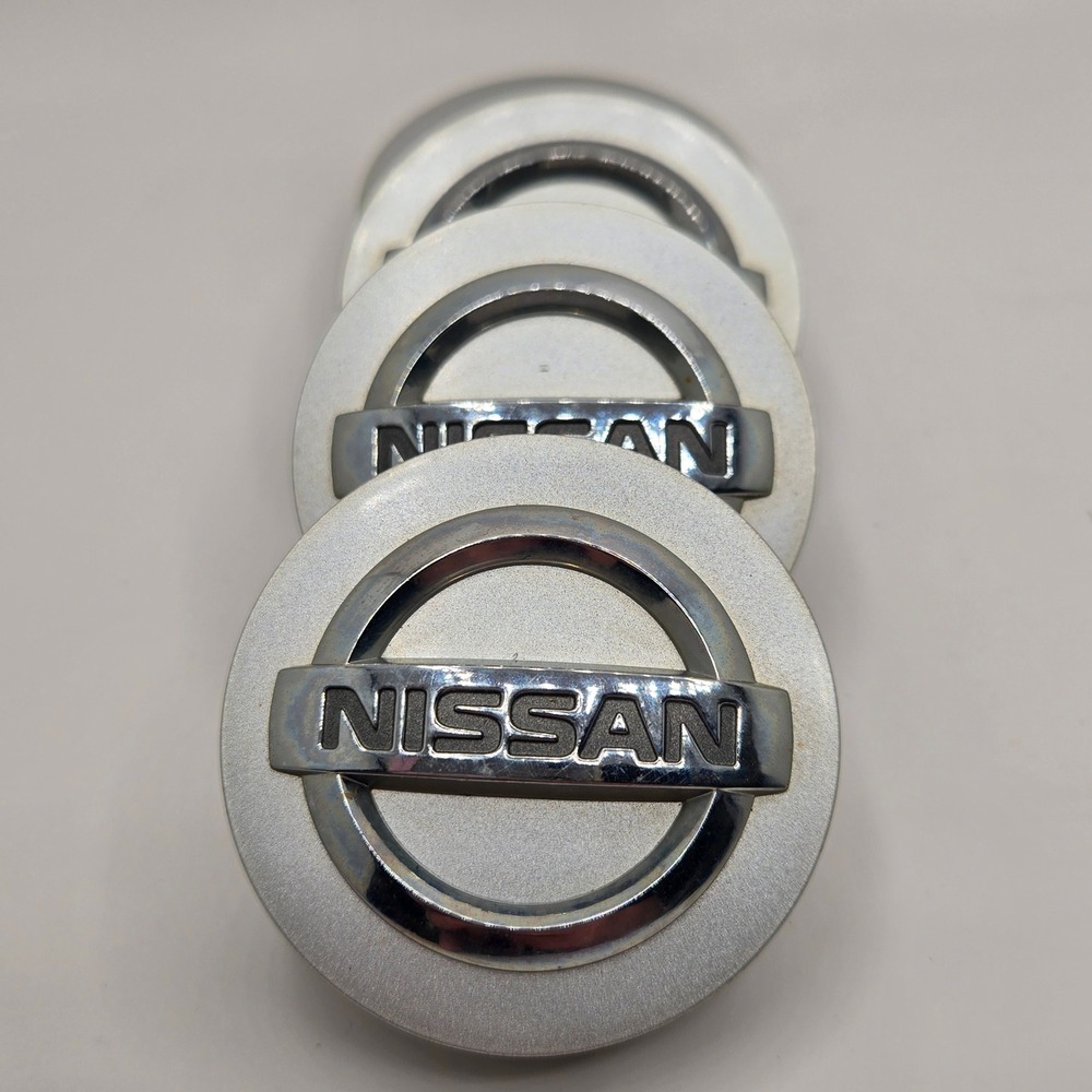 Nissan Wheel Center Caps Set of 4 Silver Chrome Logo OEM